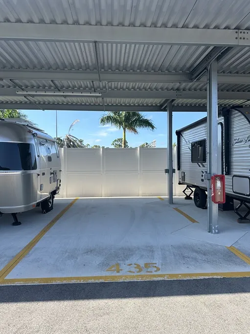 Covered parking bays for cars, trucks, and RVs at a Century Storage facility Punta Gorda