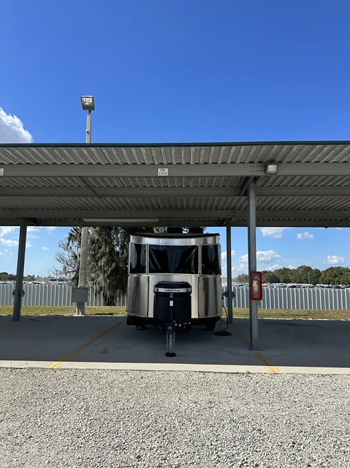 Covered parking bays for cars, trucks, and RVs at a storage facility Century Storage Riverview
